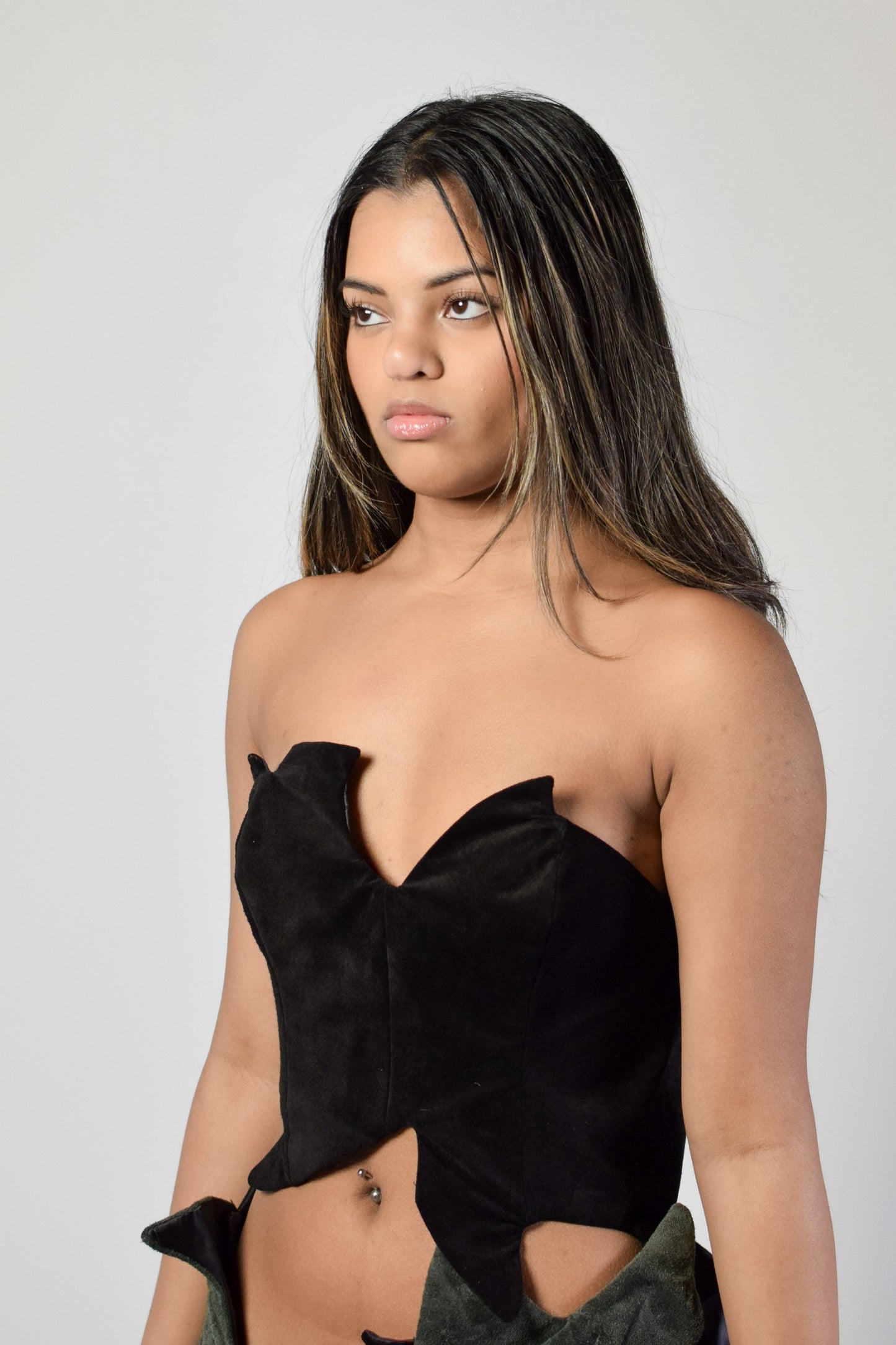 Black strapless top 
Asymmetrical top
Suede bustier
Avant garde fashion