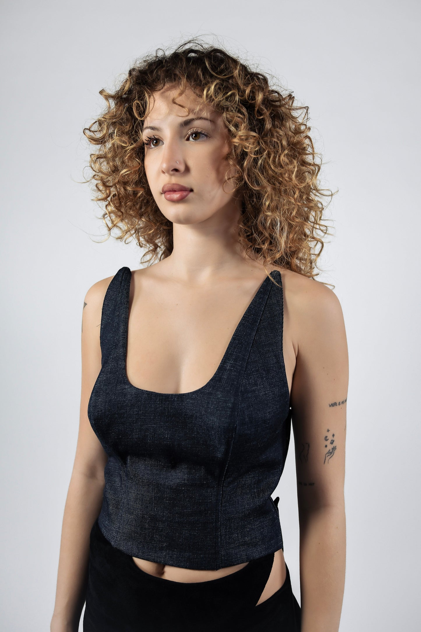 Dark denim fitted crop top with deep scoop neckline and wide shoulder straps