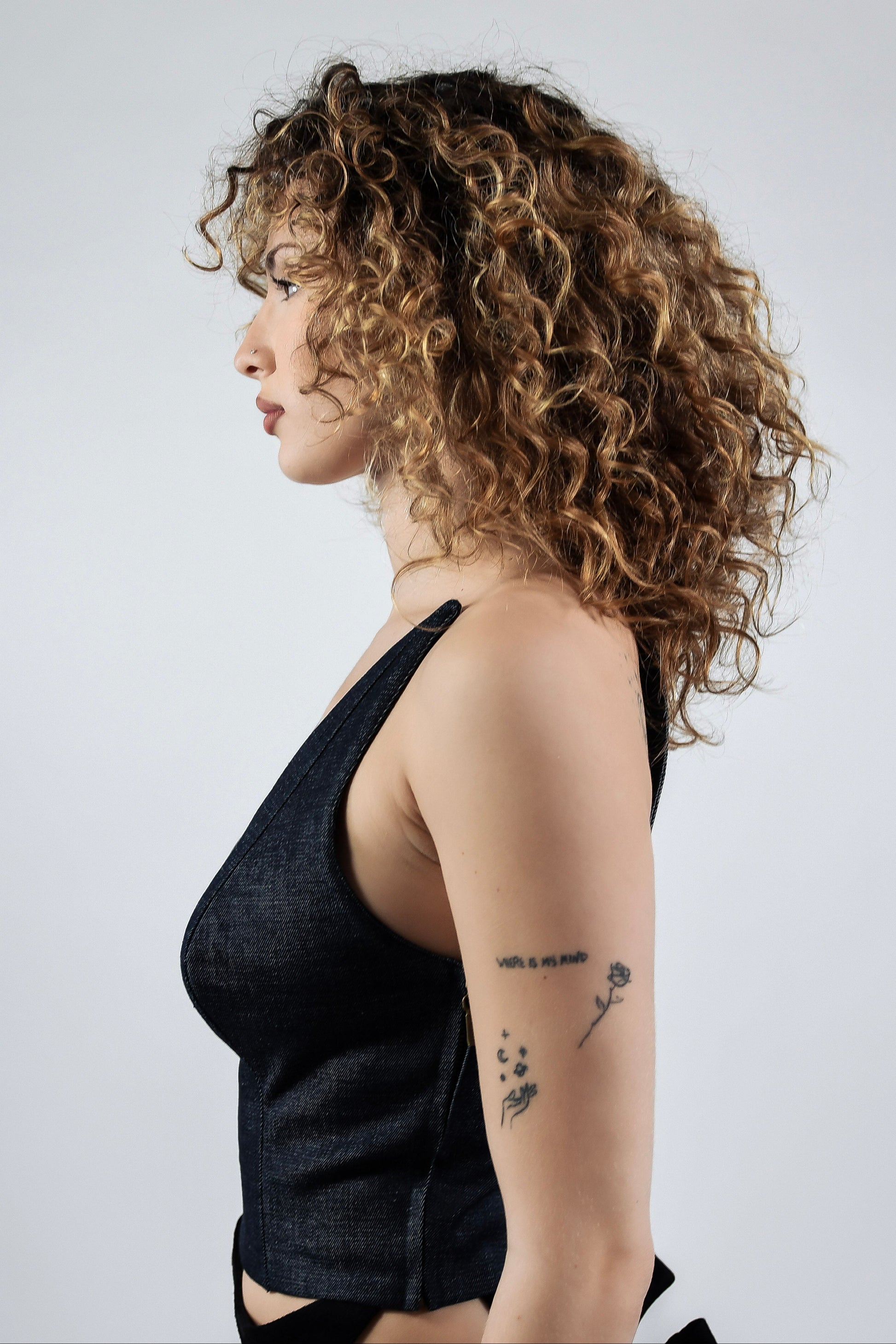 Side view of dark denim structured crop top
